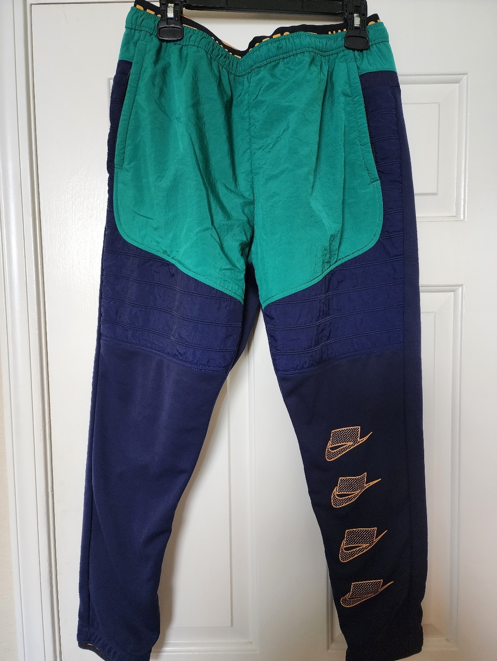 Nike Two-Tone Green & Navy Joggers with Retro Swoosh Accents and Fleece lining.